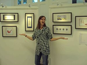 laura elliott with her illustrations at GradGallery exhibition
