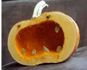 carved squash with seeds for teeth